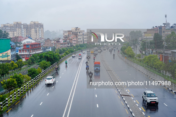 People's daily lives are affected by the heavy rainfall in Kathmandu, Nepal, on August 21, 2024. 