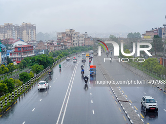 People's daily lives are affected by the heavy rainfall in Kathmandu, Nepal, on August 21, 2024. (