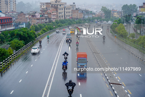 People's daily lives are affected by the heavy rainfall in Kathmandu, Nepal, on August 21, 2024. 