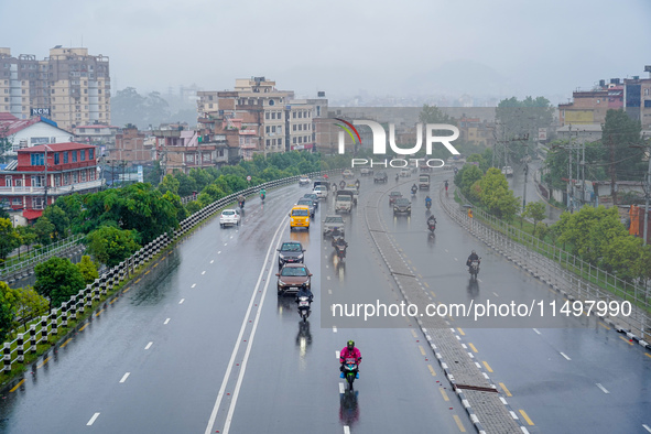 People's daily lives are affected by the heavy rainfall in Kathmandu, Nepal, on August 21, 2024. 