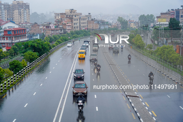 People's daily lives are affected by the heavy rainfall in Kathmandu, Nepal, on August 21, 2024. 