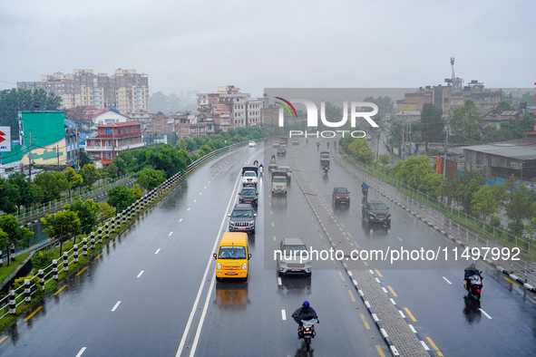 People's daily lives are affected by the heavy rainfall in Kathmandu, Nepal, on August 21, 2024. 