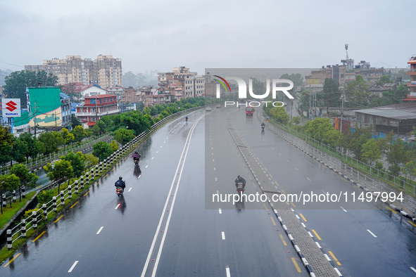 People's daily lives are affected by the heavy rainfall in Kathmandu, Nepal, on August 21, 2024. 