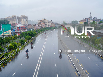 People's daily lives are affected by the heavy rainfall in Kathmandu, Nepal, on August 21, 2024. (