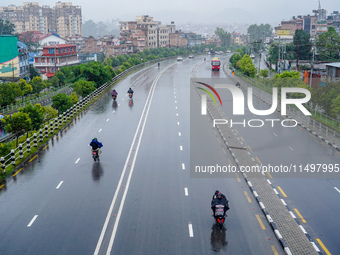 People's daily lives are affected by the heavy rainfall in Kathmandu, Nepal, on August 21, 2024. (