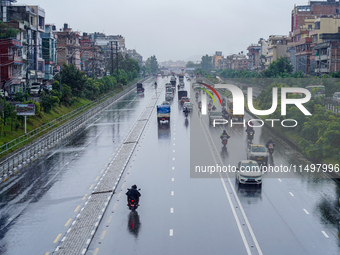 People's daily lives are affected by the heavy rainfall in Kathmandu, Nepal, on August 21, 2024. (