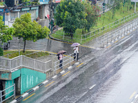 People's daily lives are affected by the heavy rainfall in Kathmandu, Nepal, on August 21, 2024. (