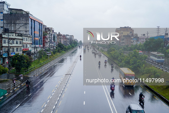 People's daily lives are affected by the heavy rainfall in Kathmandu, Nepal, on August 21, 2024. 