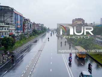 People's daily lives are affected by the heavy rainfall in Kathmandu, Nepal, on August 21, 2024. (