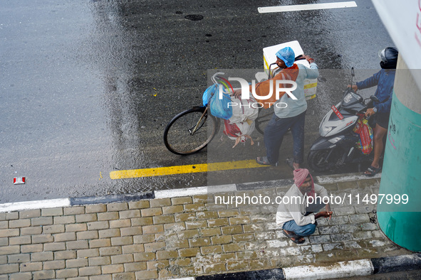 People's daily lives are affected by the heavy rainfall in Kathmandu, Nepal, on August 21, 2024. 