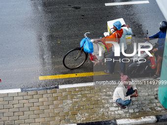 People's daily lives are affected by the heavy rainfall in Kathmandu, Nepal, on August 21, 2024. (