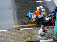 People's daily lives are affected by the heavy rainfall in Kathmandu, Nepal, on August 21, 2024. (