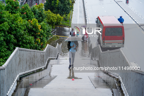 People's daily lives are affected by the heavy rainfall in Kathmandu, Nepal, on August 21, 2024. 