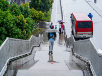 People's daily lives are affected by the heavy rainfall in Kathmandu, Nepal, on August 21, 2024. (