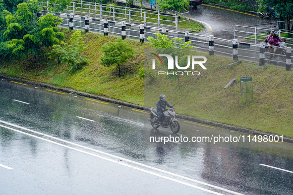 People's daily lives are affected by the heavy rainfall in Kathmandu, Nepal, on August 21, 2024. 