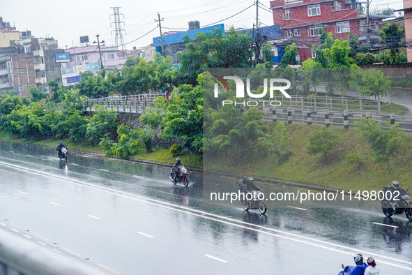 People's daily lives are affected by the heavy rainfall in Kathmandu, Nepal, on August 21, 2024. 