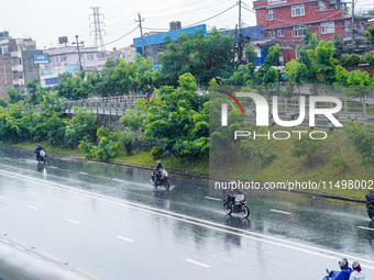 People's daily lives are affected by the heavy rainfall in Kathmandu, Nepal, on August 21, 2024. (