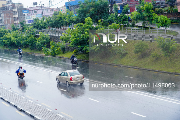 People's daily lives are affected by the heavy rainfall in Kathmandu, Nepal, on August 21, 2024. 