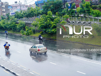 People's daily lives are affected by the heavy rainfall in Kathmandu, Nepal, on August 21, 2024. (