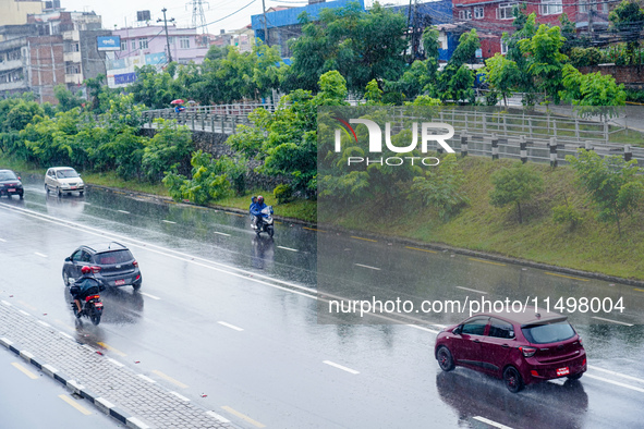 People's daily lives are affected by the heavy rainfall in Kathmandu, Nepal, on August 21, 2024. 