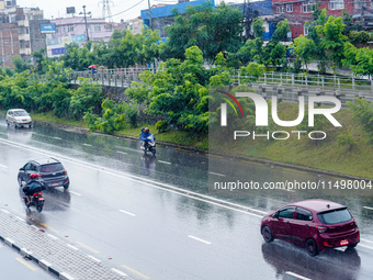 People's daily lives are affected by the heavy rainfall in Kathmandu, Nepal, on August 21, 2024. (