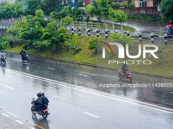 People's daily lives are affected by the heavy rainfall in Kathmandu, Nepal, on August 21, 2024. (