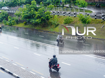 People's daily lives are affected by the heavy rainfall in Kathmandu, Nepal, on August 21, 2024. (