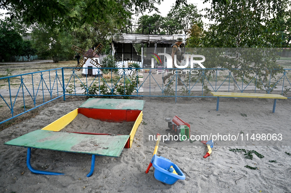 Toys are scattered at a playground near the Levada children's cafe in the central park damaged by a Russian artillery shell strike in Maloka...