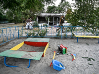 Toys are scattered at a playground near the Levada children's cafe in the central park damaged by a Russian artillery shell strike in Maloka...