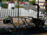 A burnt-out table and chairs are at the Levada children's cafe in the central park destroyed by a Russian artillery shell strike in Malokate...