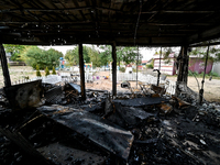 Burnt-out tables and chairs are at the Levada children's cafe in the central park destroyed by a Russian artillery shell strike in Malokater...