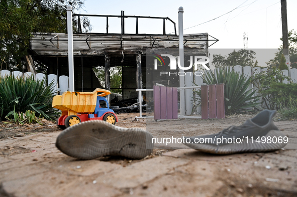 A pair of sneakers of one of the children wounded by a Russian artillery shell strike on the Levada cafe is on the ground in the central par...