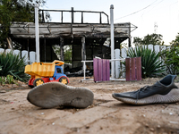 A pair of sneakers of one of the children wounded by a Russian artillery shell strike on the Levada cafe is on the ground in the central par...