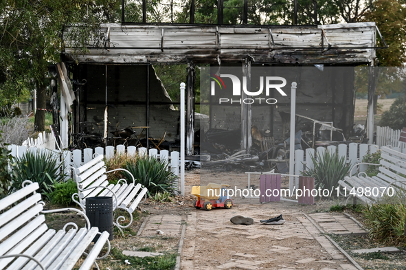 A toy truck is seen outside the Levada children's cafe in the central park damaged by a Russian artillery shell strike in Malokaterynivka vi...