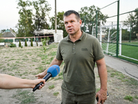 Volodymyr Sosunovskyi, head of the Kushuhum community, speaks to the press near the Levada cafe in the central park destroyed by a Russian a...