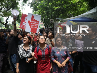 Medical students and doctors attend a protest rally against the rape and murder of a PGT woman doctor at Government-run R G Kar Medical Coll...