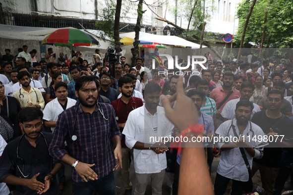 Medical students and doctors attend a protest rally against the rape and murder of a PGT woman doctor at Government-run R G Kar Medical Coll...