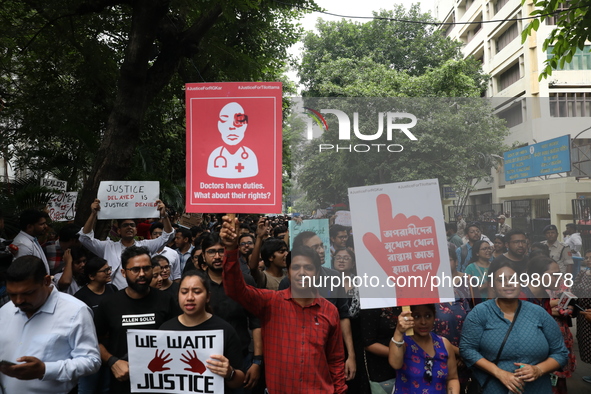 Medical students and doctors attend a protest rally against the rape and murder of a PGT woman doctor at Government-run R G Kar Medical Coll...