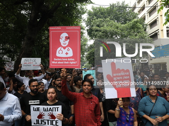 Medical students and doctors attend a protest rally against the rape and murder of a PGT woman doctor at Government-run R G Kar Medical Coll...