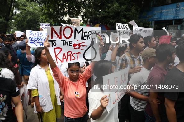 Medical students and doctors attend a protest rally against the rape and murder of a PGT woman doctor at Government-run R G Kar Medical Coll...