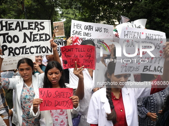 Medical students and doctors attend a protest rally against the rape and murder of a PGT woman doctor at Government-run R G Kar Medical Coll...