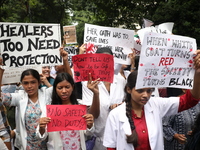 Medical students and doctors attend a protest rally against the rape and murder of a PGT woman doctor at Government-run R G Kar Medical Coll...