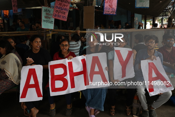 Medical students hold placards protesting against the rape and murder of a PGT woman doctor at Government-run R G Kar Medical College & Hosp...