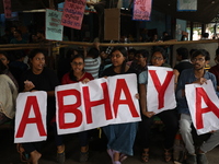 Medical students hold placards protesting against the rape and murder of a PGT woman doctor at Government-run R G Kar Medical College & Hosp...