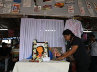 A medical student lights a candle as she protests against the rape and murder of a PGT woman doctor at Government-run R G Kar Medical Colleg...