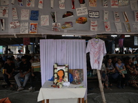 Medical students sit behind an altar of framed images as they protest against the rape and murder of a PGT woman doctor at Government-run R...