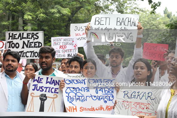 Medical students and doctors attend a protest rally against the rape and murder of a PGT woman doctor at Government-run R G Kar Medical Coll...