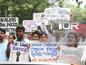 Medical students and doctors attend a protest rally against the rape and murder of a PGT woman doctor at Government-run R G Kar Medical Coll...