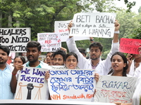 Medical students and doctors attend a protest rally against the rape and murder of a PGT woman doctor at Government-run R G Kar Medical Coll...