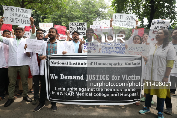 Medical students and doctors attend a protest rally against the rape and murder of a PGT woman doctor at Government-run R G Kar Medical Coll...